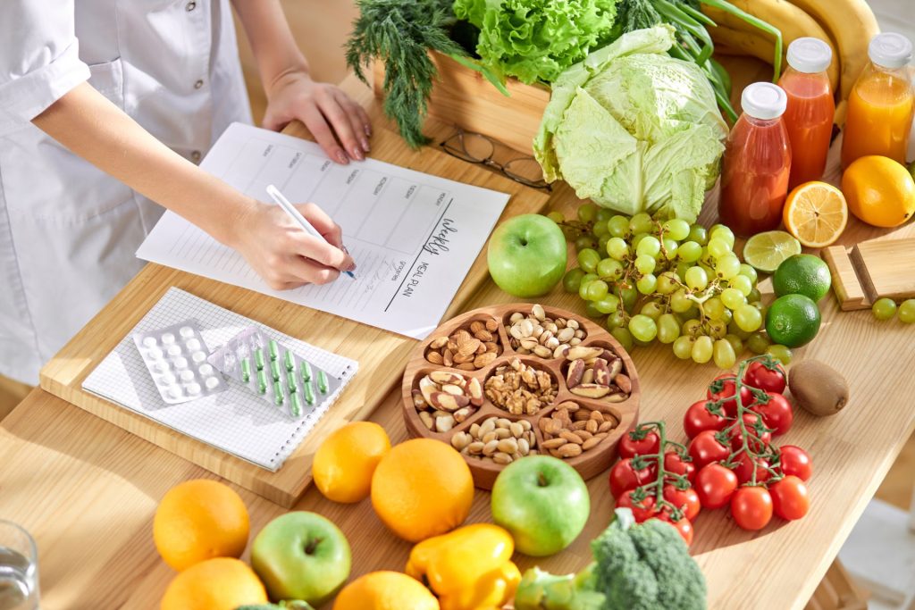 Healthy fruits and vegetables on table